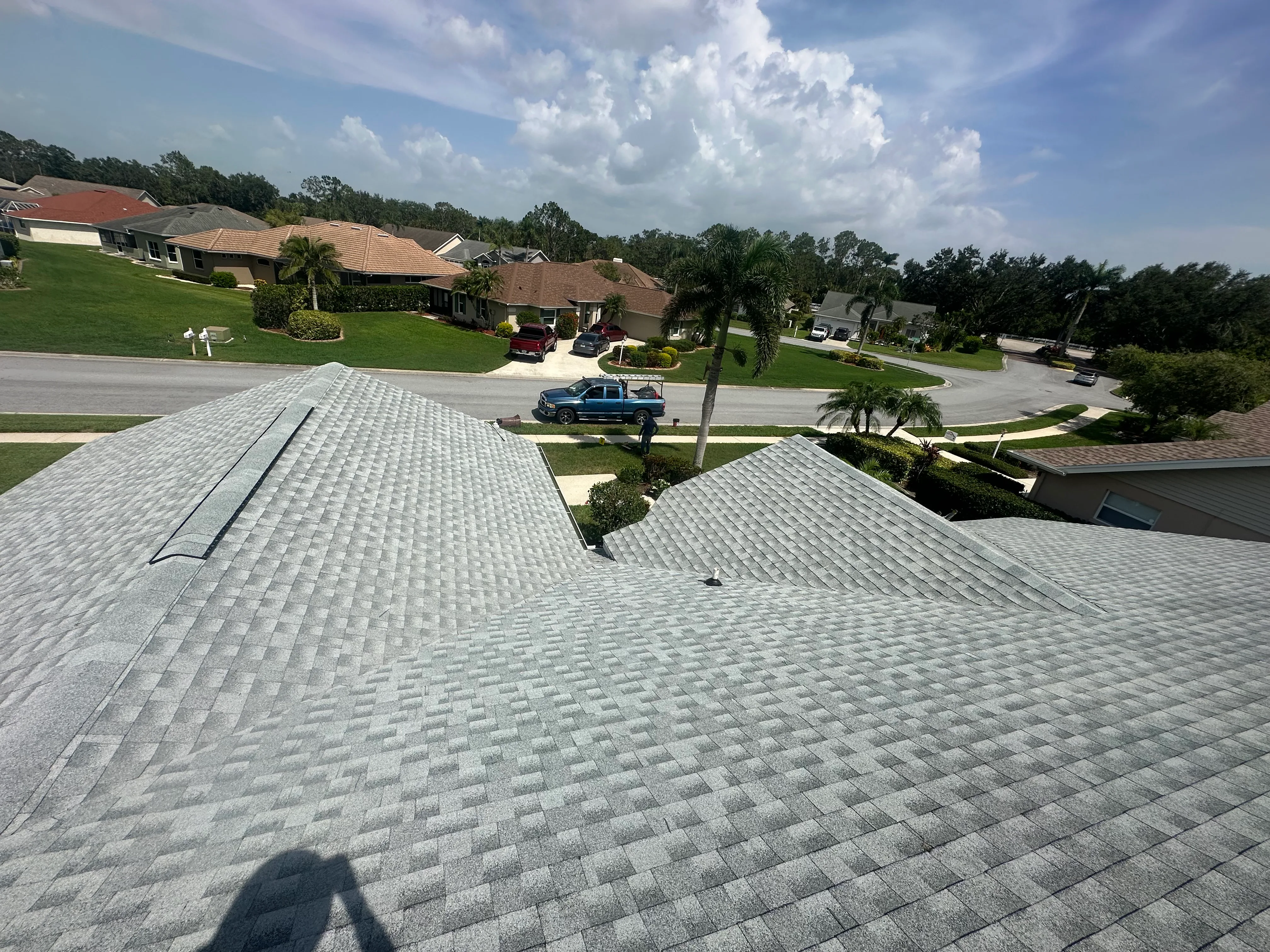 Residential roof installation on suburban property