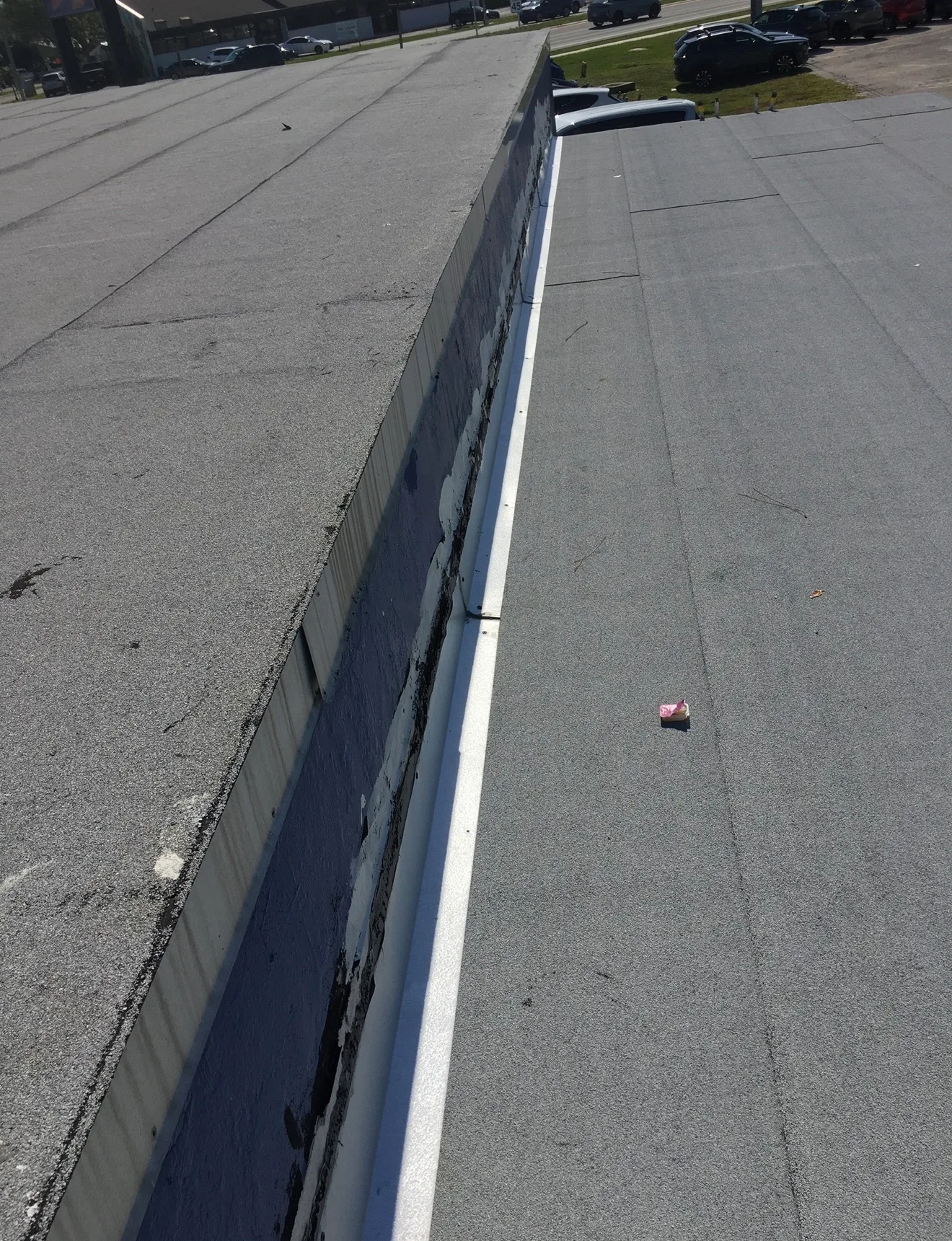 Commercial flat roof with white perimeter trim