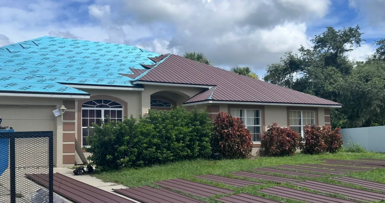 Modern residential home with turquoise metal roof