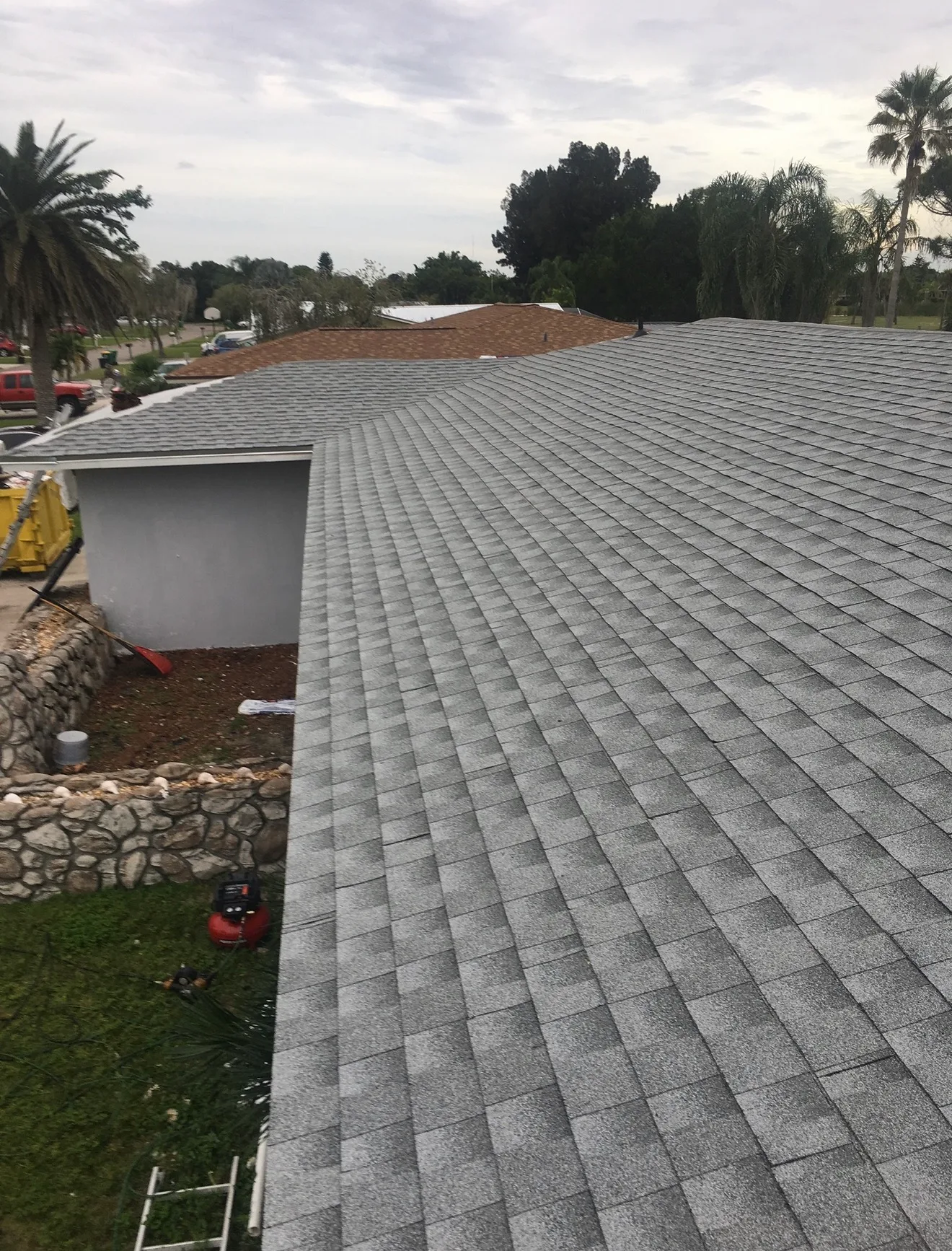 Gray asphalt roof shingles residential installation