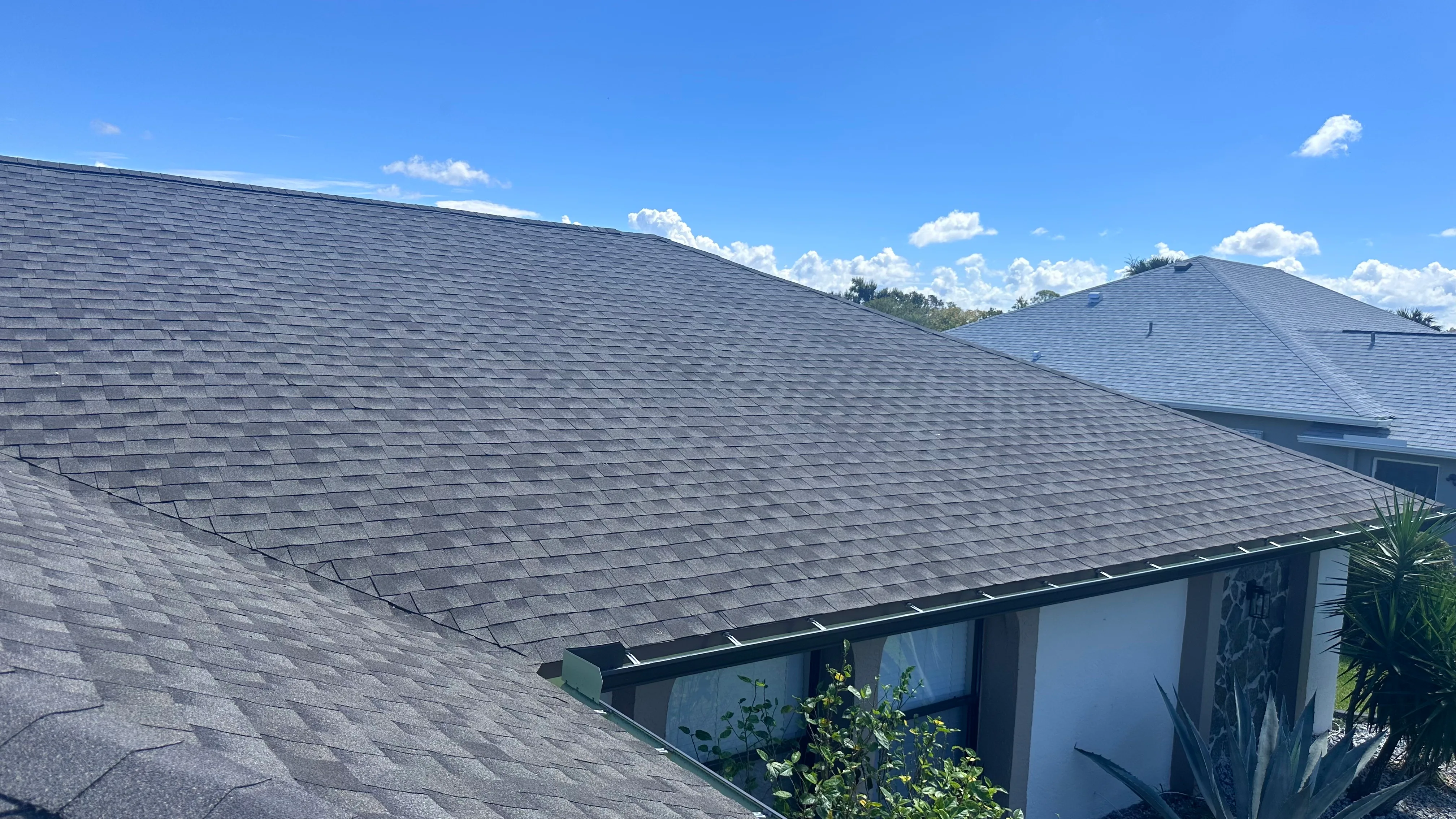 Professionally installed gray asphalt shingle roof