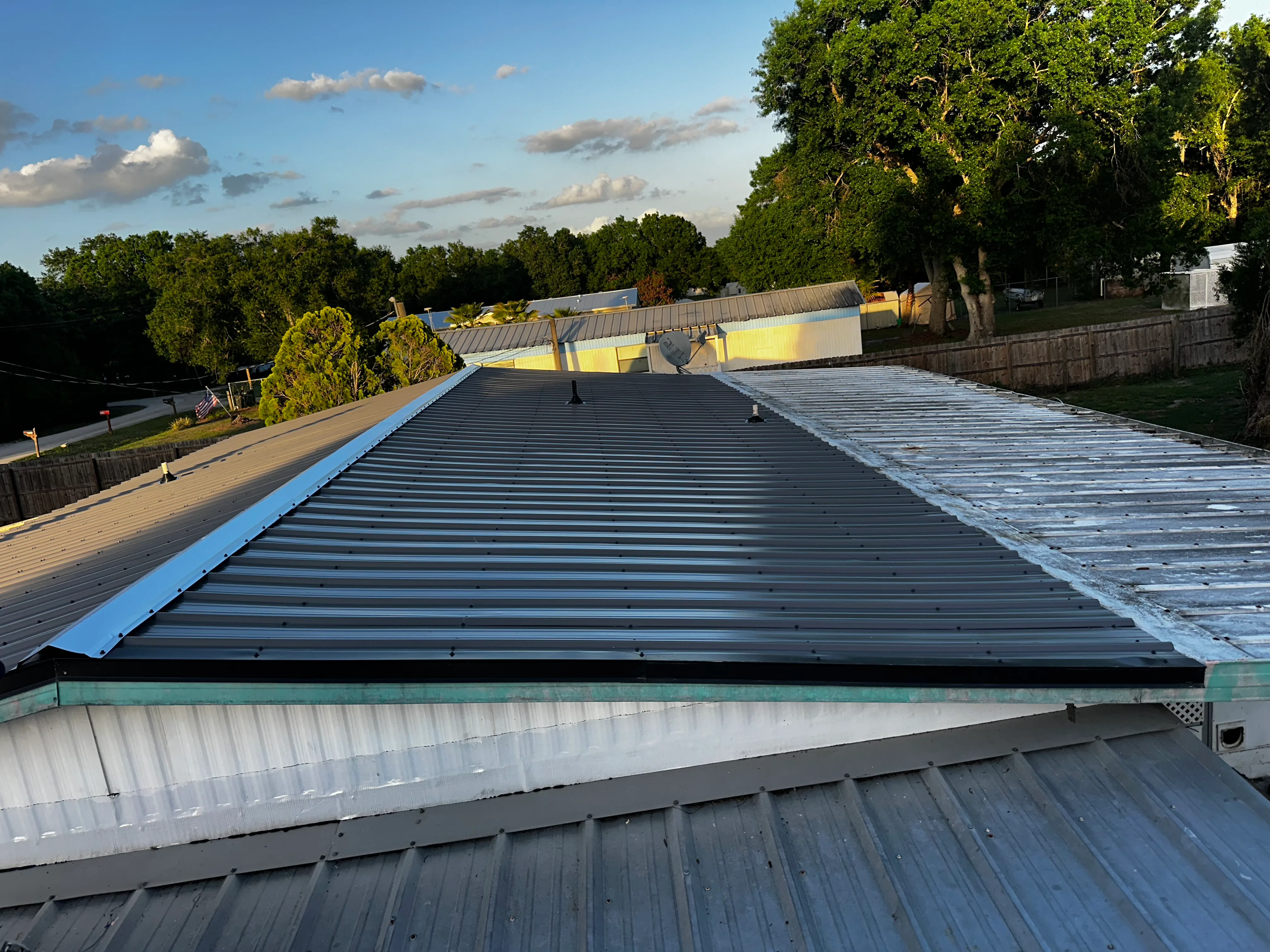 Metal roofing installation on commercial building