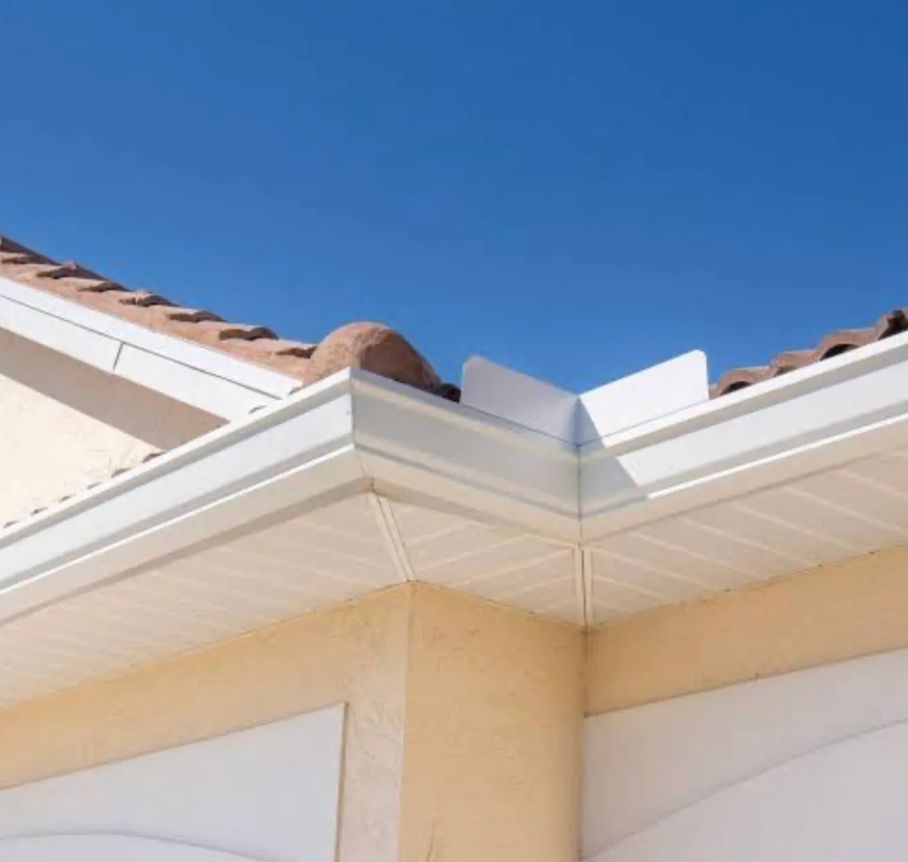 Seamless gutter and soffit fascia installation detail on residential home exterior