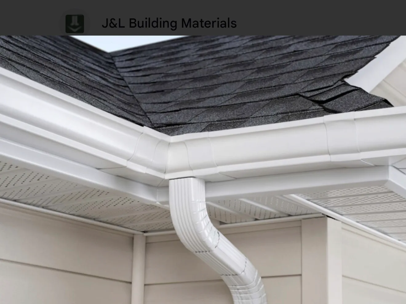 Professional seamless gutters and downspout installation on dark shingle roof