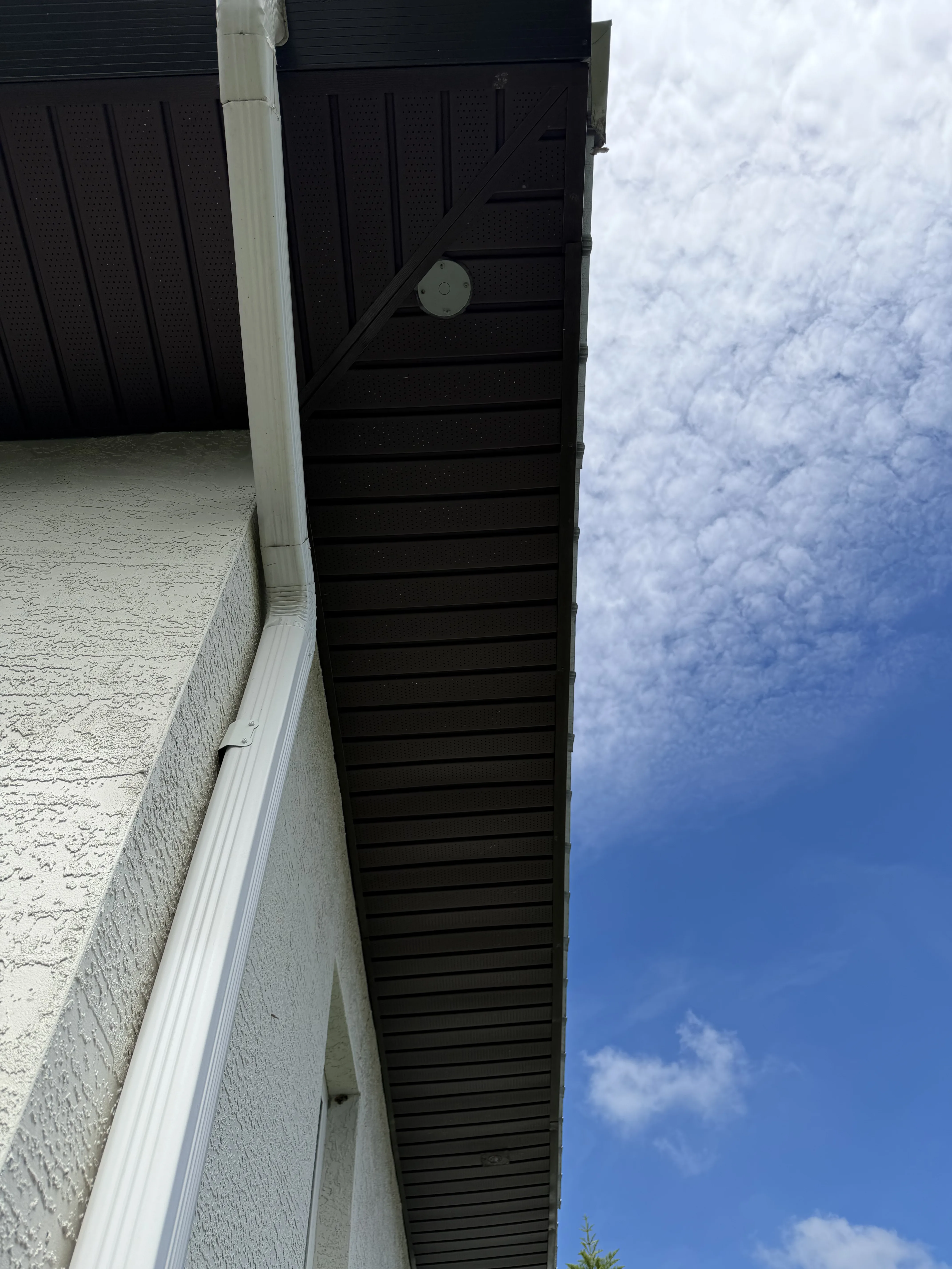 Standing Seam Metal Roof with white soffit and fascia trim