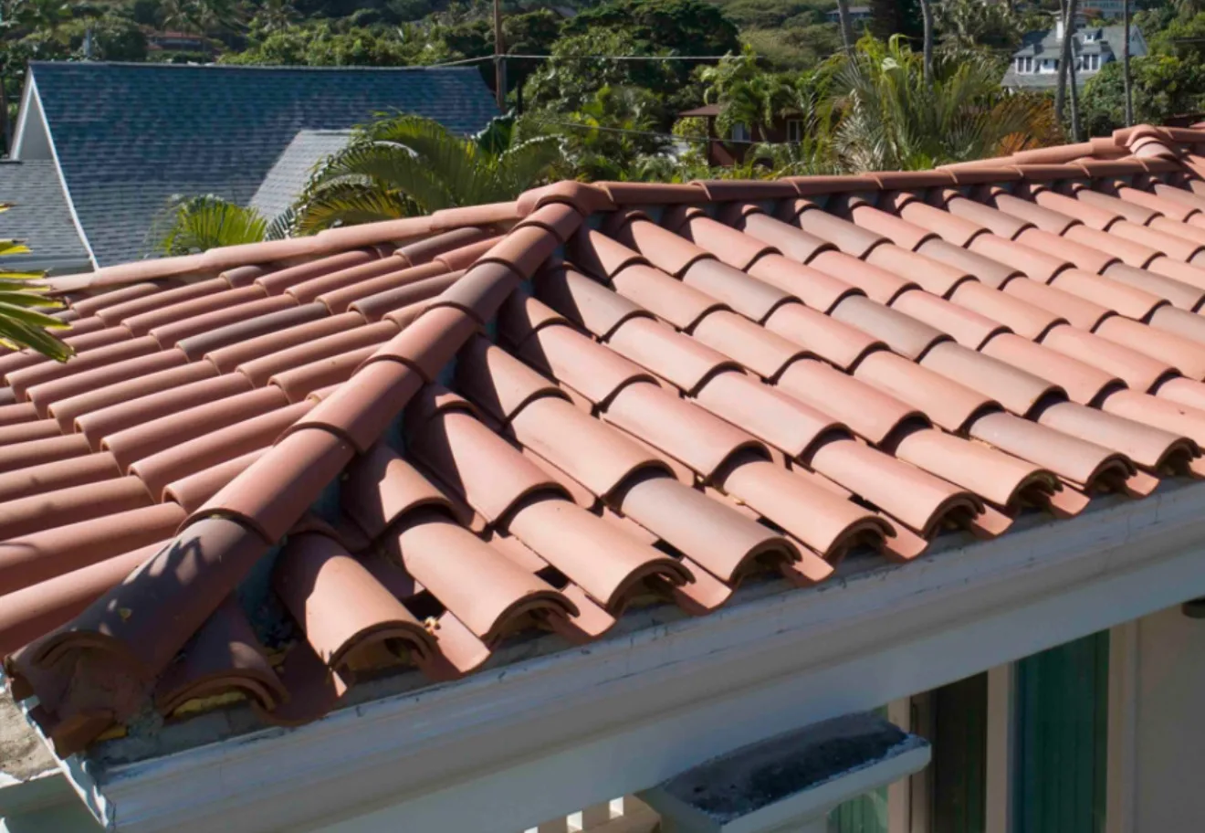 Tile Roof Replacement with newly installed terra cotta tiles showing professional quality installation work